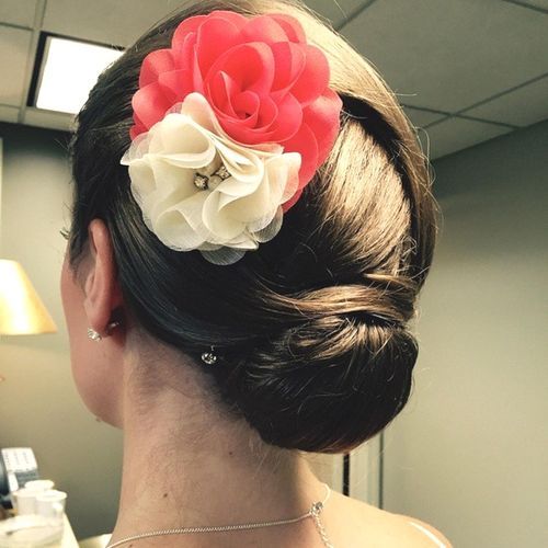 Unique Twisted Bun with Floral Decorations for Medium Hair