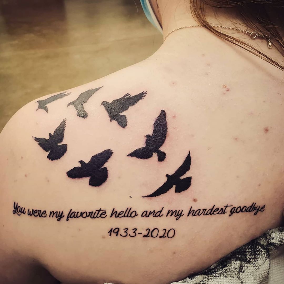 flying birds tattoo on the back shoulder