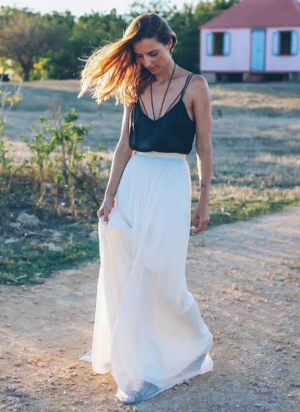 Dress up a tulle skirt for a summer event with a silk top like Jess Ann Kirby.