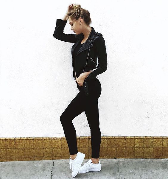 all-black look with a leather jacket and white Vans