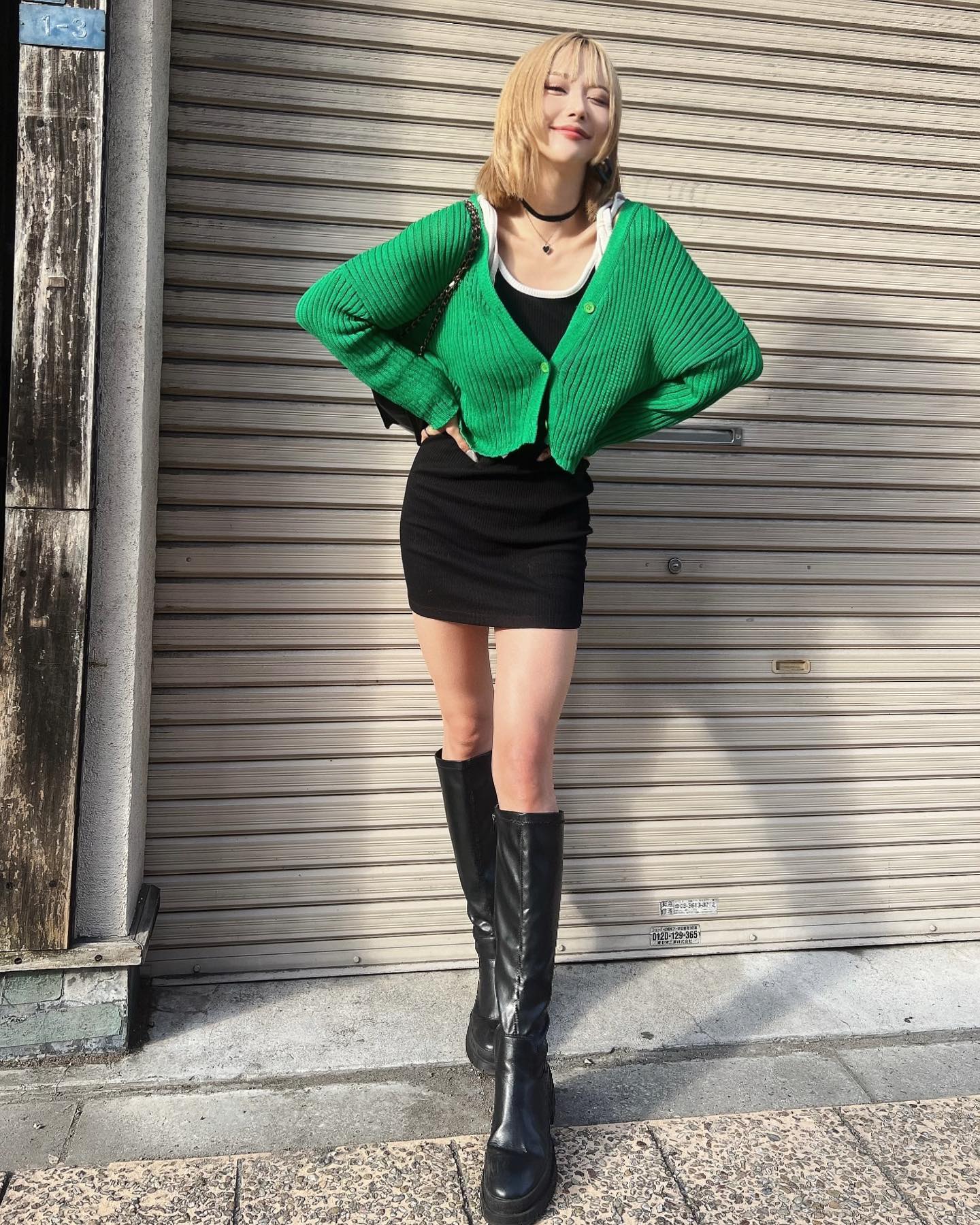 green sweater and boots