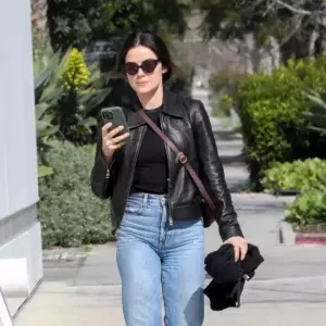 Lucy Hale rocks a leather jacket and jeans while grabbing some lunch to go at Catch Steak in West Hollywood California