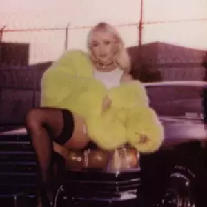Sabrina Carpenter Yellow Fur Coat