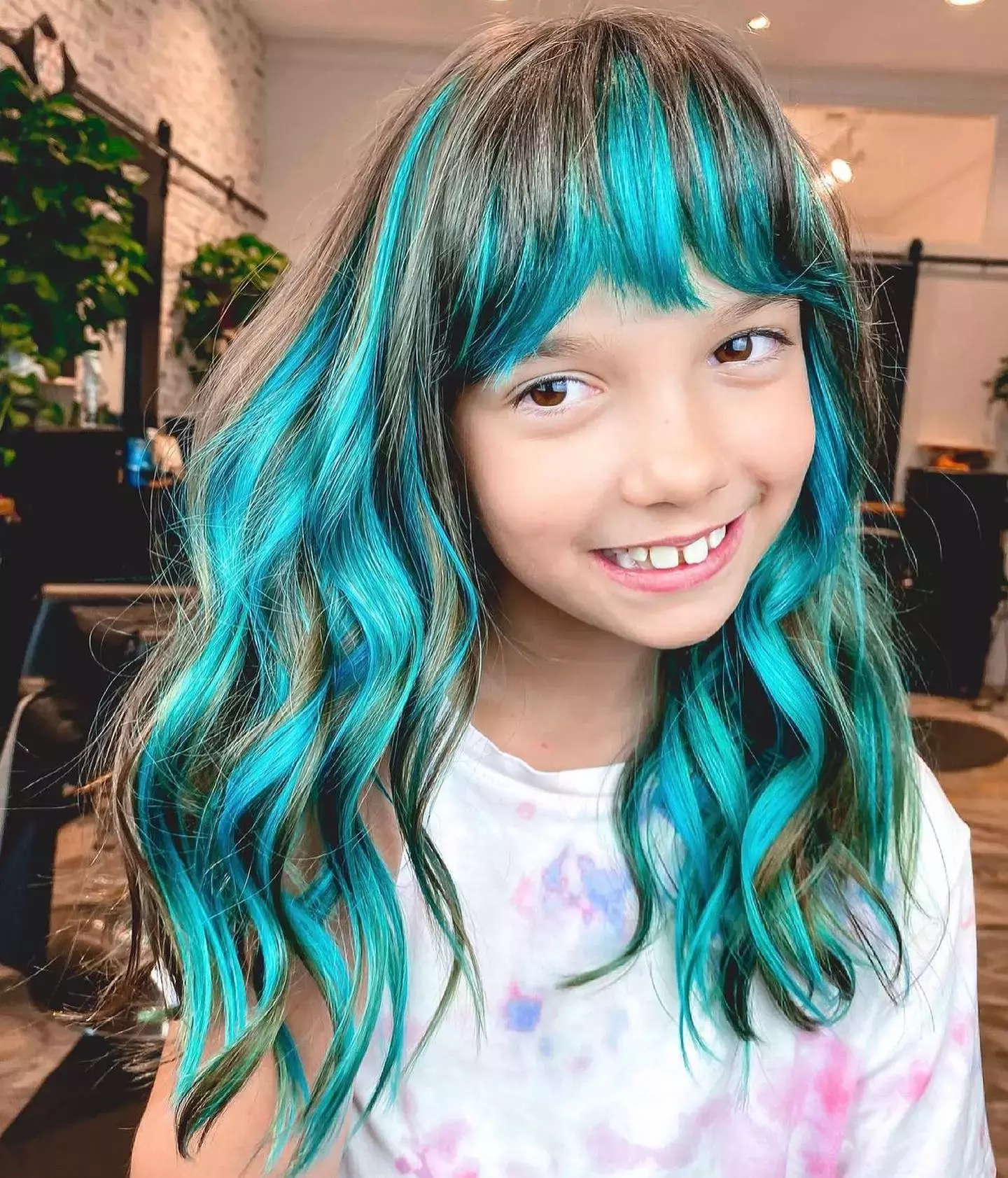 Turquoise Highlights On Young Curls